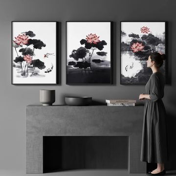 Minimalist grey living room with person admiring set of 3 Asian-inspired lotus wall art prints above console table