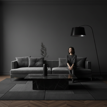 A bright apartment living room with wall art hung at the ideal eye-level height above a sofa
