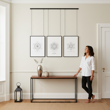A beautifully layered gallery wall demonstrating how to layer wall art like interior designers