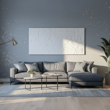 A contemporary living room showcasing minimalist interior design styles with a grey sectional sofa and blue walls