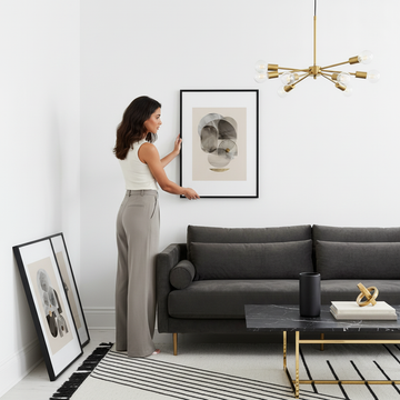 A styled living room exploring whether wall art should match furniture colour throughout the space
