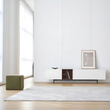 13. Acacia white TV stand in a bright living room with framed art