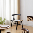 15. Eenoch black dining chair beside a window