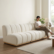 15. Yilmaz modular sofa with a person reading