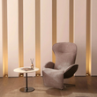 2. Abt swivel recliner beside a marble side table