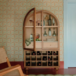 2. Akhtar Pahlavi natural wood wine cabinet with an open door