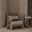 2. Delaney armchair with a throw beside a side table