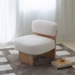 2. Evander white boucle chair beside a window