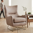 2. Henry light taupe armchair in an ivory living room with a person in the background