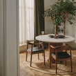 3. Kennedy dark oak dining chair beside a window