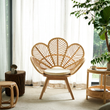 3. Larkin rattan lounge chair beside sheer curtains