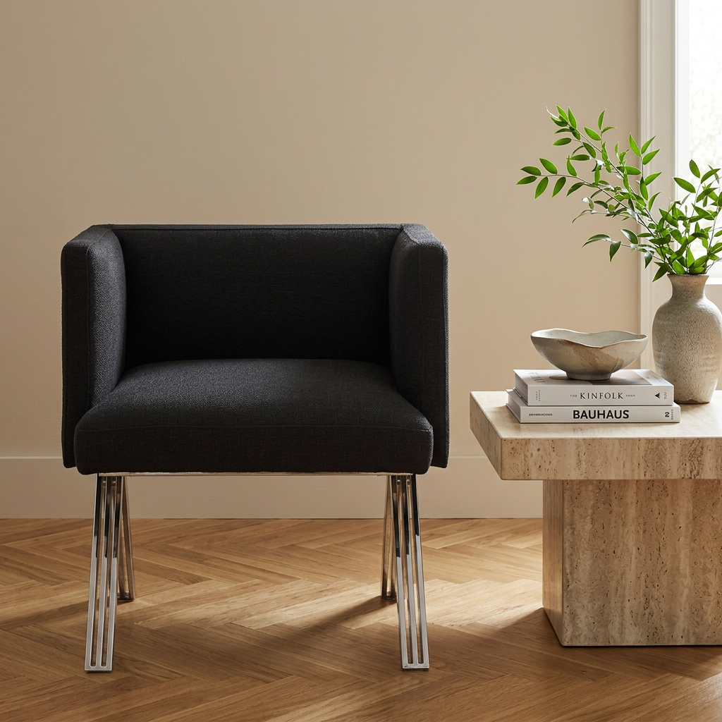 3. Piermount black chair beside a styled side table against a beige wall