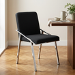 3. Piermount black fabric dining chair beside a walnut table in a beige dining room