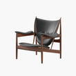 Modern chair with dark gray leather seat and backrest on a white background