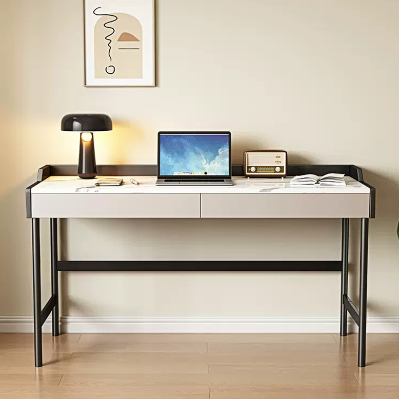 Modern desk with laptop, lamp, and decor in a minimalistic room.