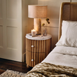 4. Ava Luxe white marble bedside table with a lamp and candle