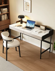 Modern home office with a white desk, chair, and laptop.