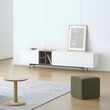5. Acacia white TV stand beside an olive green footstool