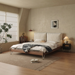 5. Arendt bed viewed at an angle beside a bedroom window
