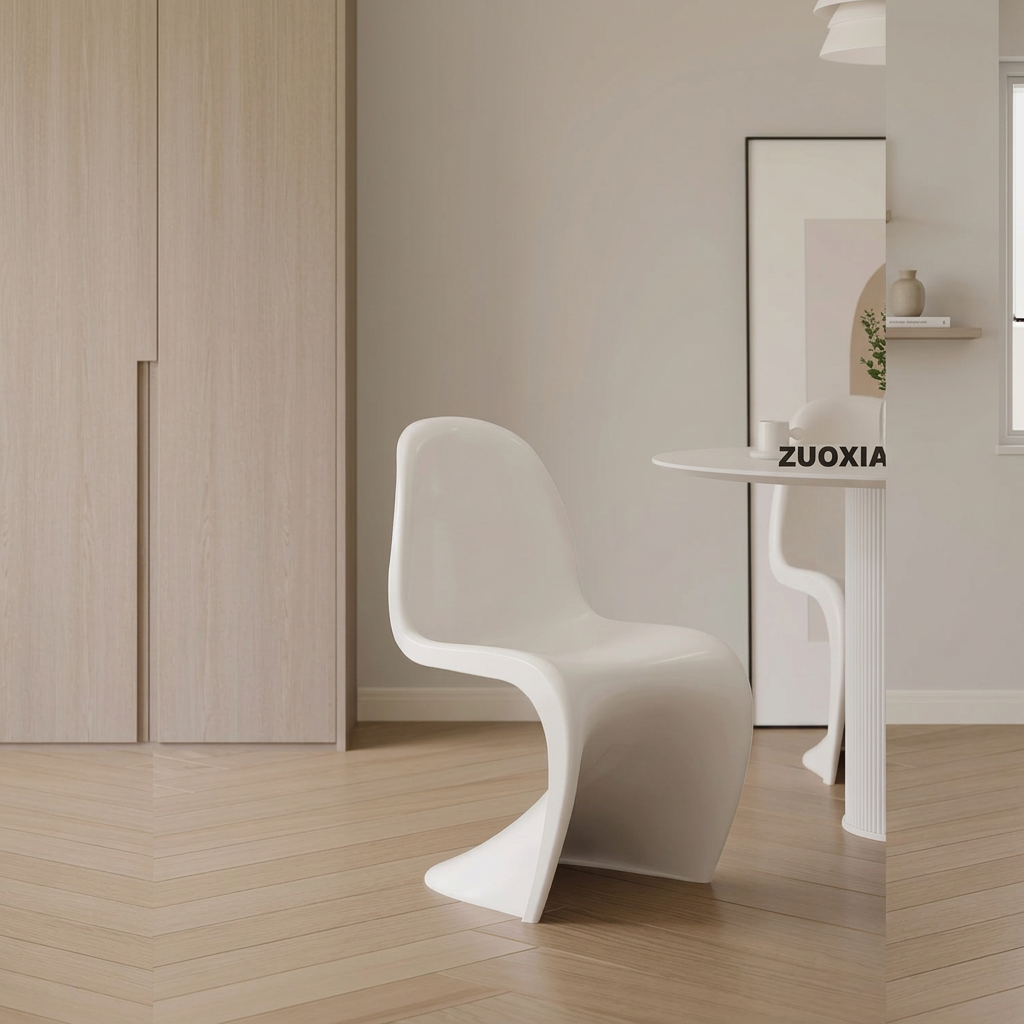 6. Aimee white dining chair beside framed art and a round table