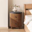 6. Ava Luxe black marble bedside table with a flower vase