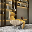 7. Abt mustard swivel recliner beside illuminated shelves