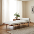 7. Barcelona white leather daybed in a contemporary ivory living room