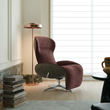 8. Abt plum swivel recliner beside a window