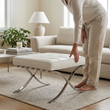 8. Barcelona white leather ottoman with a person standing beside it