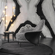 8. Diakite armchair side view against a marble wall