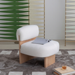 8. Evander white boucle chair with an open magazine