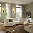 8. Zafar curved sofa with a mustard cushion viewed from above