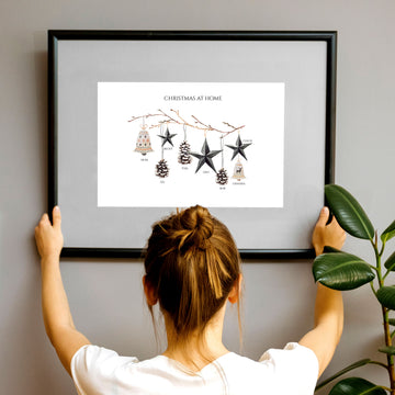 Observe a young woman hanging a one-of-a-kind, personalised wall art print on the wall