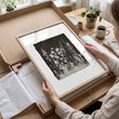 Bathroom Decor Sets Dark Botanical Wildflower & Blossom wall art displayed on a wall in a styled room