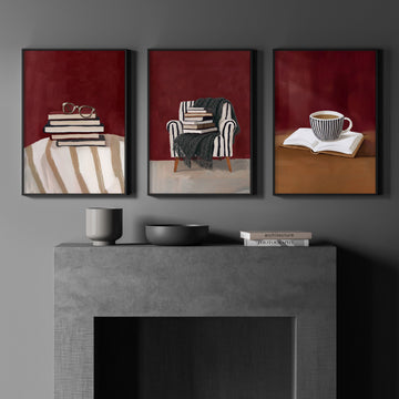 Canvas Wall Art Sets of 3 Burgundy Book Lover Reading Nook wall art displayed on a wall in a styled room