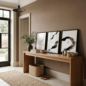 Canvas Zen Wall Art | Black Ink Brushstroke & Lone Figure Japanese Minimalist Art wall art displayed on a wall in a styled room