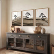 Framed Asian Wall Art Japanese Ink Bonsai Pine Trees on Rolling Hills displayed on a wall in a styled room