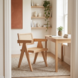 Cebu natural cane dining chair in a bright home office in a wide room view