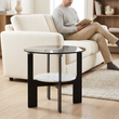 Imperia grey glass and white ceramic round coffee table in a bright living room with a person in the background