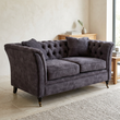Sabrina grey velvet sofa viewed from above at an angle in a contemporary living room