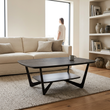 Imperia grey marble effect ceramic coffee table in a living room with a person in the background