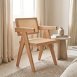 Cebu natural cane dining chair viewed from above at an angle in a bedroom dressing corner
