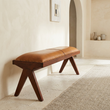 Inca tan leather and teak wood bench viewed from above at an angle in a contemporary hallway