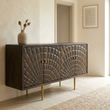 Sipari dark mango wood carved sideboard viewed from above at an angle in a contemporary hallway