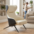Kiev ivory and black leather effect armchair in a bright living room with a person in the background