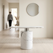 Sesto white marble console table in a bright hallway with a person in the background