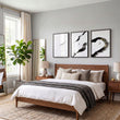 Japan Art Ink Brush Solitary Figure Black White Gold-Toned wall art displayed on a wall in a styled room