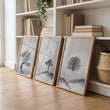 Large 3 Piece Wall Art for Living Room | Scandinavian Nordic Trees & Moon Landscape displayed on a wall in a styled room — view 12