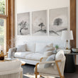 Large 3 Piece Wall Art for Living Room | Scandinavian Nordic Trees & Moon Landscape displayed on a wall in a styled room — view 2