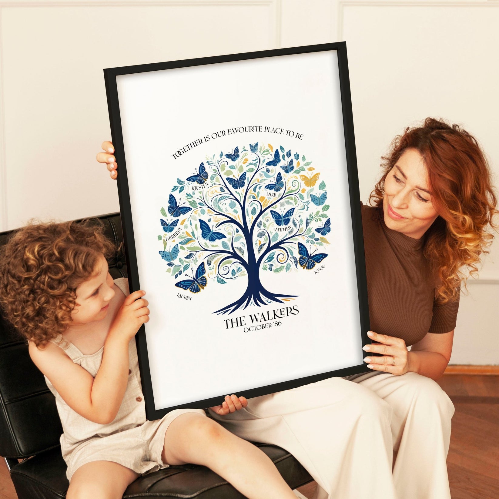 Multi-generational family admiring personalised family tree wall art